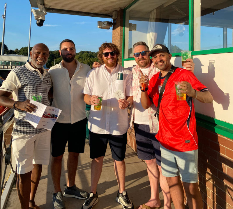 Group of gentlemen celebrating win at dunstall park greyhound stadium